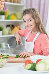 Young girl cooking in kitchen at home