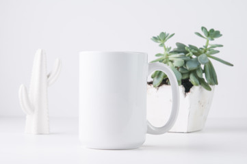 white mug mockup in a styled setting with a white background