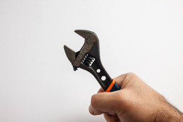 Obraz premium hand of a worker with a wrench