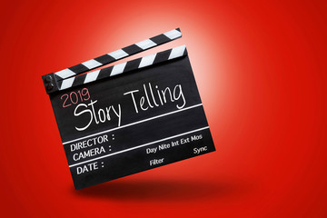 2019 story telling ,text title on movie Clapper board on red colour backgrounds