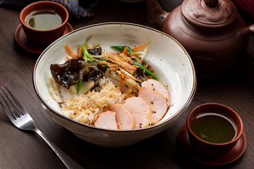 Rice with chicken and mushrooms in an Asian restaurant
