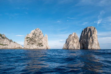 Sea stacks off the coast of Capri, Italy. They are named Stella, Faraglione di Mezzo with the arch,...