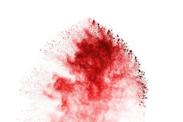 Freeze motion of red powder exploding, isolated on white background. Abstract design of red dust cloud. Particles explosion screen saver, wallpaper