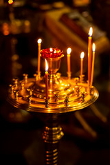 candles are in candlesticks in the temple