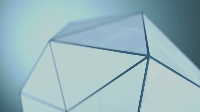 Polygonal shape with grunge surface. Abstract techno structure close-up. Seamless loop 3D render animation with shallow depth of field 4k UHD 3840x2160

