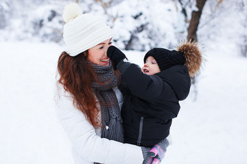 Mother with the baby outdoor.