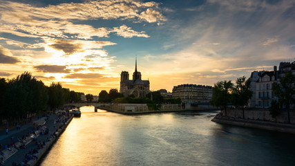 Notre damme cathedral under beautiful colrful sky during golden hour