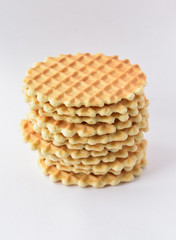 A stack round waffles isolated over white background.