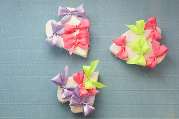 heart with multicolored bows of ribbons on a light background