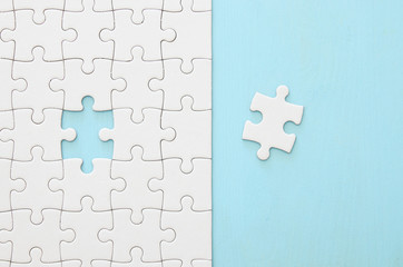 background of white puzzle with missing piece.