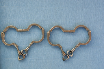 Clamp for connecting metal pipes in the distiller, clamps on a blue background for fixing metal pipes.