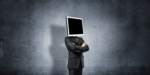 Businessman with monitor instead of head.