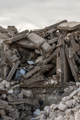 Fototapeta na wymiar destroyed building - Concrete stone debris from destroyed building 