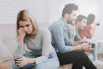 Young People Playing Videogames on Party at Home.