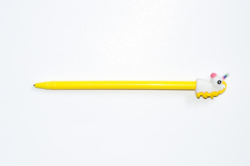  A pen for writing with a cap in the shape of a unicorn on a black and white background