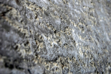 Gray texture of natural. Raw salt in an underground salt mineRock salt.