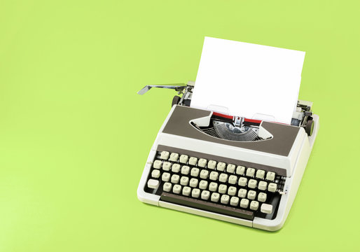 Vintage typewriter on color background