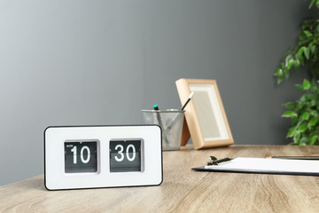 Stylish flip clock on table in office,  space for text. Time management