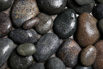 Composition with spa stones as background, top view