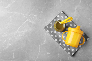 Flat lay composition with baby food and space for text on gray background