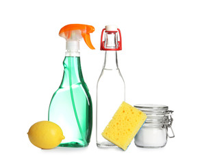 Composition with vinegar, lemon and baking soda on white background. House cleaning