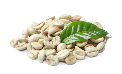 Green coffee beans and fresh leaf on white background