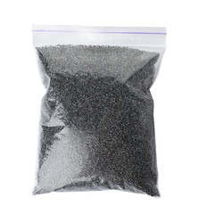 Poppy seeds in plastic bag on white background, top view