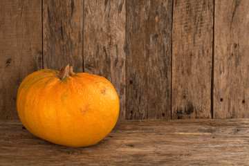 pumpkin over wooden background