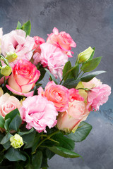 Rose fresh flowers bouquet on gray table close up