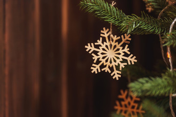 Wooden snowflake made of plywood on the Christmas tree. Products Laser cutting. Rustic Christmas...