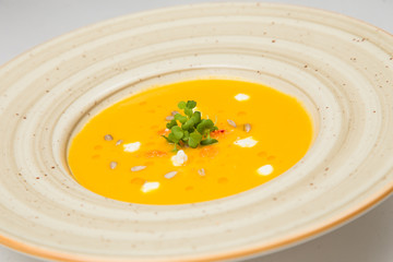 Pumpkin soup on a white background