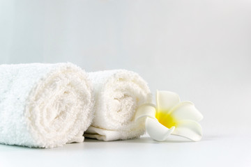 Fototapeta na wymiar Pile of clean cotton bath towels on concrete background, laundry or bathroom concept