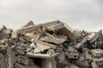  destroyed building - concrete and metal debris of a destroyed building - destroyed building