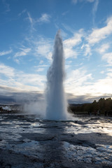 eruption of geyser Strokkur during dusk, Iceland