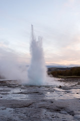 eruption of geyser Strokkur during dusk, Iceland