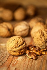 Walnuts on an old wooden table. Healthy Nuts. Blurred background. Vegetarian food.