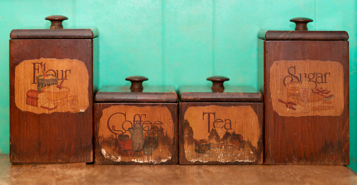 Flour, Coffee, Tea and Sugar wooden storage box on blue wall