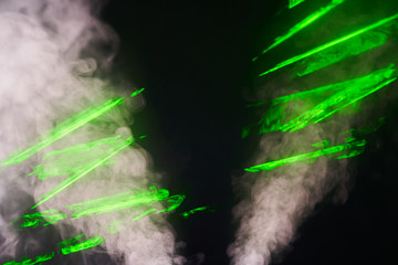 Water vapor with the effects of the laser beam and a multicolored light