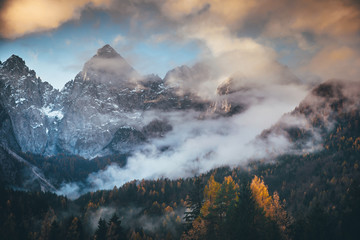 Mist and autumn rock mountains