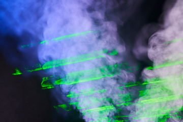 Obraz na płótnie Canvas Water vapor with the effects of the laser beam and a multicolored light