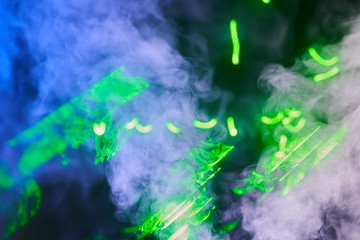 Water vapor with the effects of the laser beam and a multicolored light