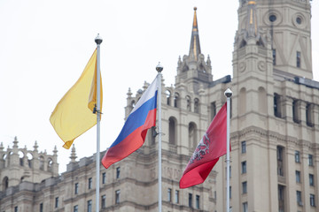 Fototapeta premium Russian flags on building background
