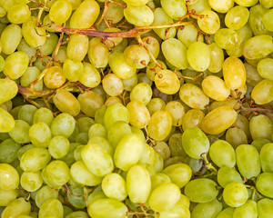 juicy yellow green grapes top view, natural background
