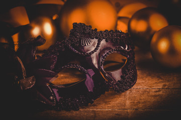 Carnival mask and gifts. Photo in old color image style