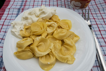 Tortelloni ricotta on white plate.