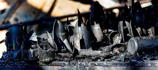 Close up Burned damaged ruins of destroyed bottles supermarket arson investigation insurance