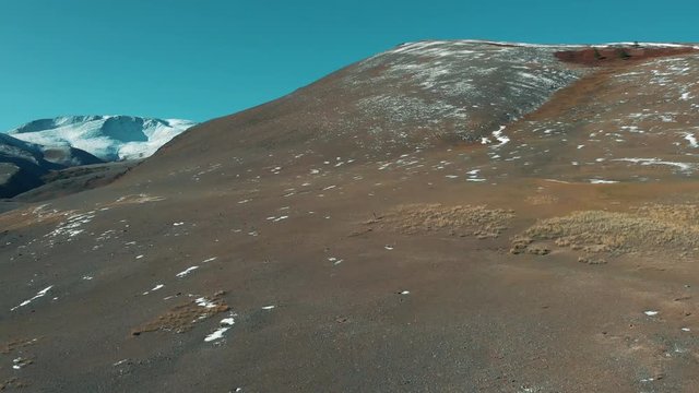 The argali (the mountain sheep, wild sheep) is on a mountainside. Saylyugemsky National Park. Aerial view 4k