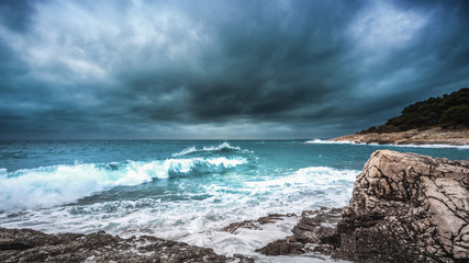 Stormy clouds and big waves on the Mali Losinj beach in Croatia