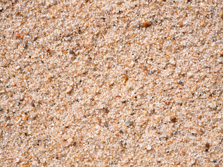 Close-up of grainy sand. Grains or granules of sand texture. Large crystals of clean river or lake or sea sand. High-quality macro photography.