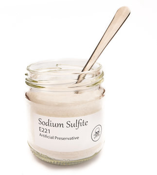 Sodium Sulfite E221 jar isolated on white with poison skull symbol.